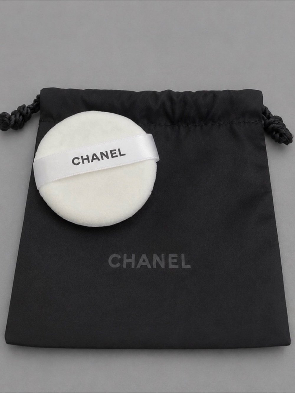 CHANEL Small Drawstring
Cosmetic Bag & Powder Puff Set
